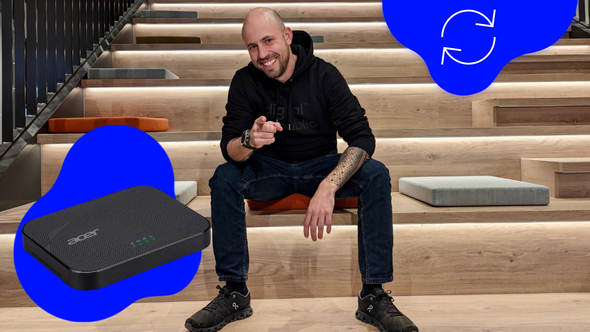 Raphi auf Treppe mit 5G Router zeigt auf Betrachter